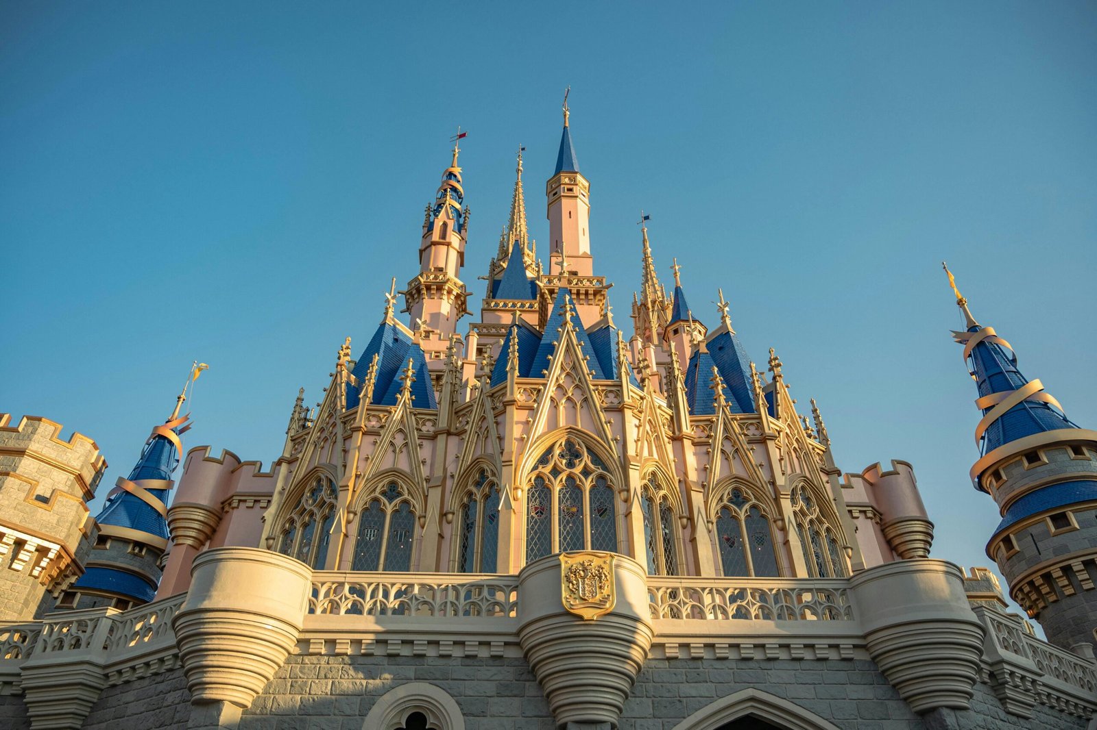 Stunning low-angle view of the iconic Cinderella Castle at Disney World, capturing its architectural beauty.